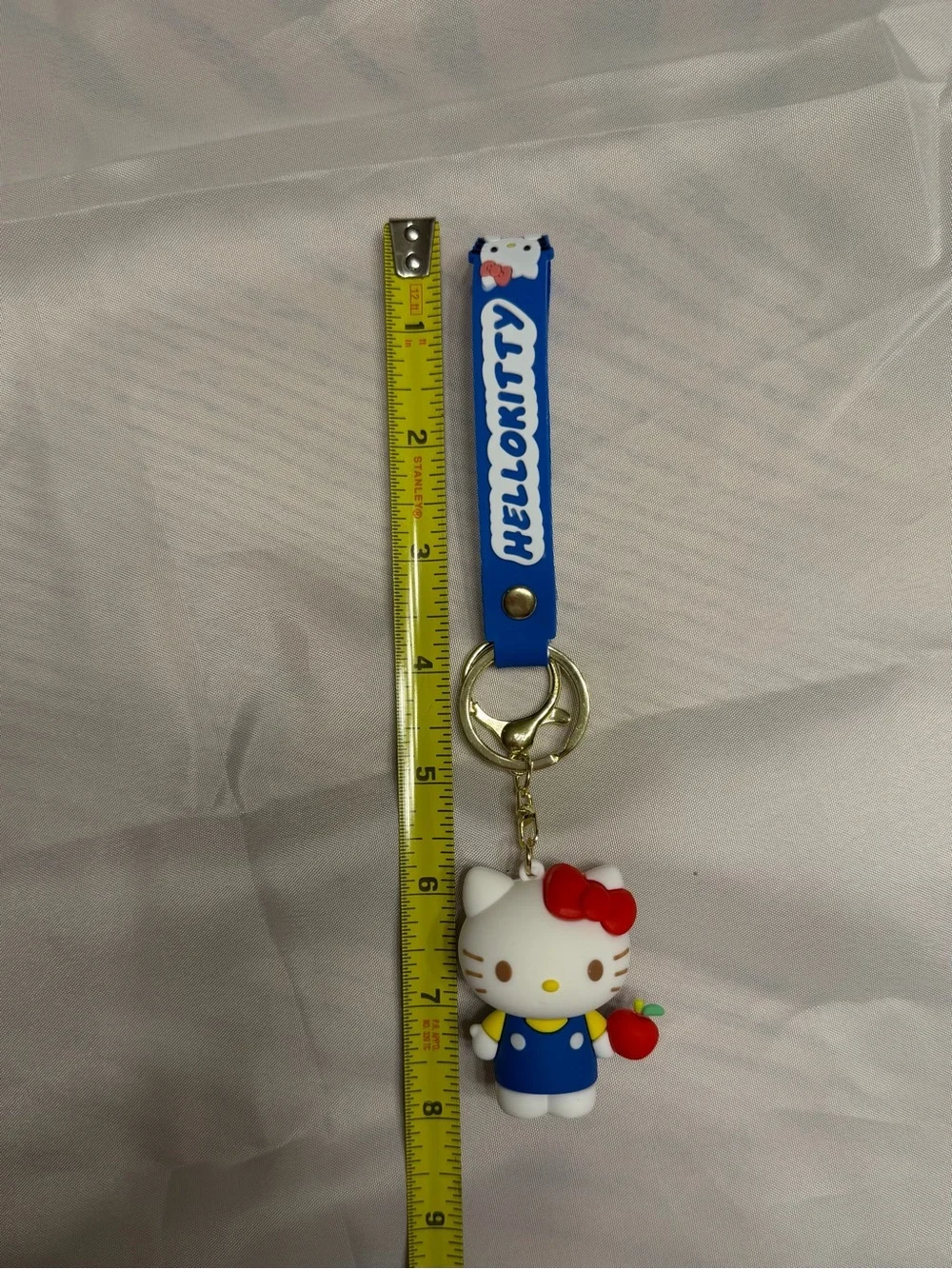 Hello Kitty White Figure Keychain/Wristlet with Red Bow and Blue Outfit & apple